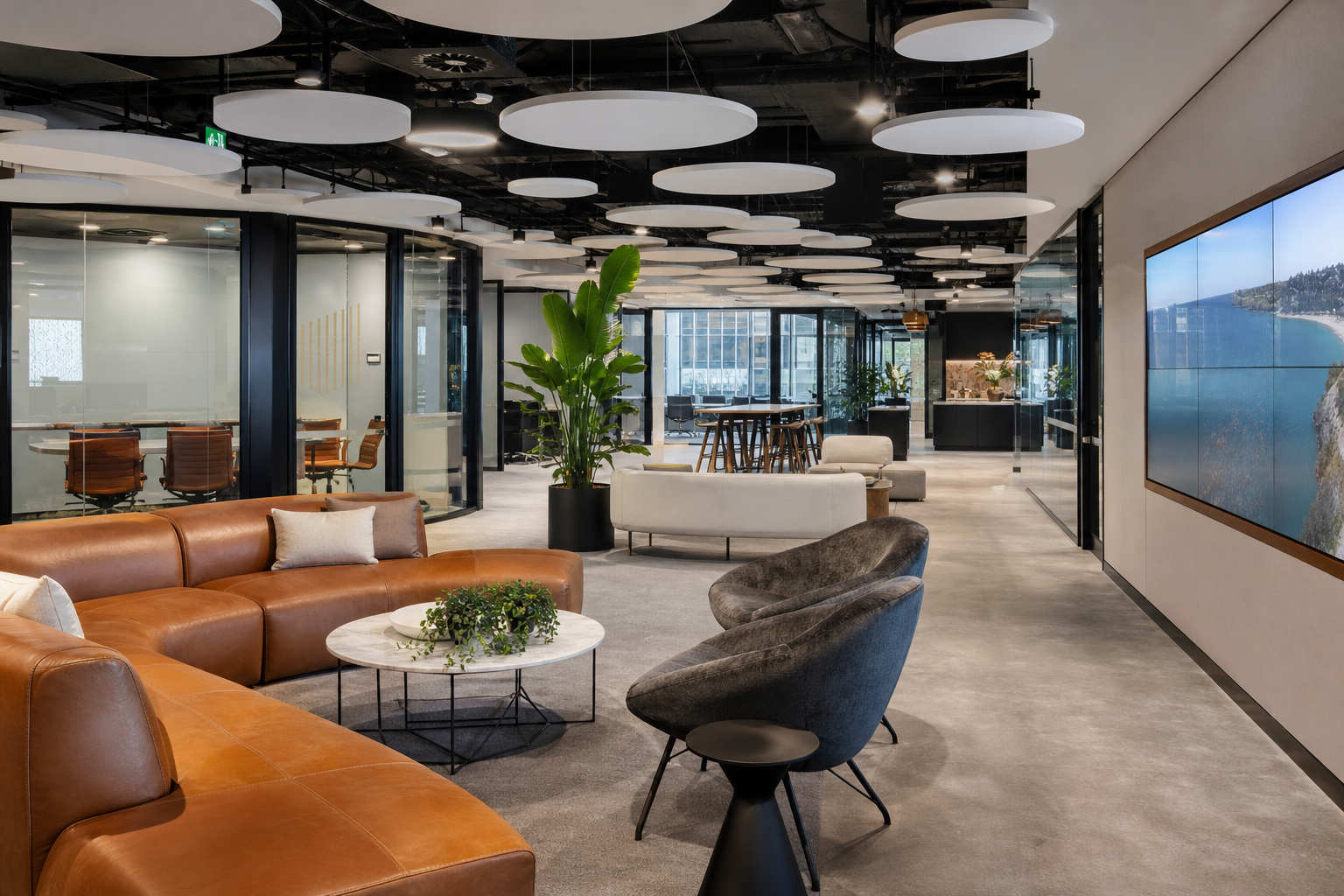 Completed commercial office fitout Sydney — collaborative workspace with meeting rooms and breakout area