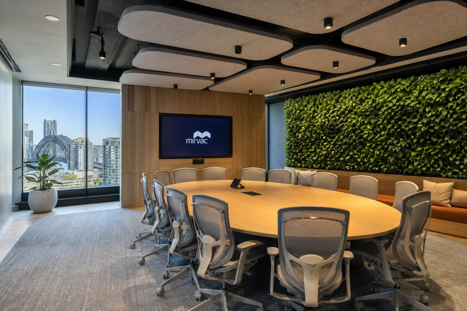 Completed modern office meeting room — integrated AV, acoustic treatment, and biophilic design elements