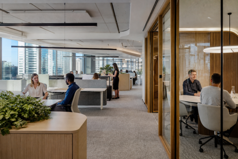 Commercial office fitout Sydney workplace with open plan desks and glazed meeting room