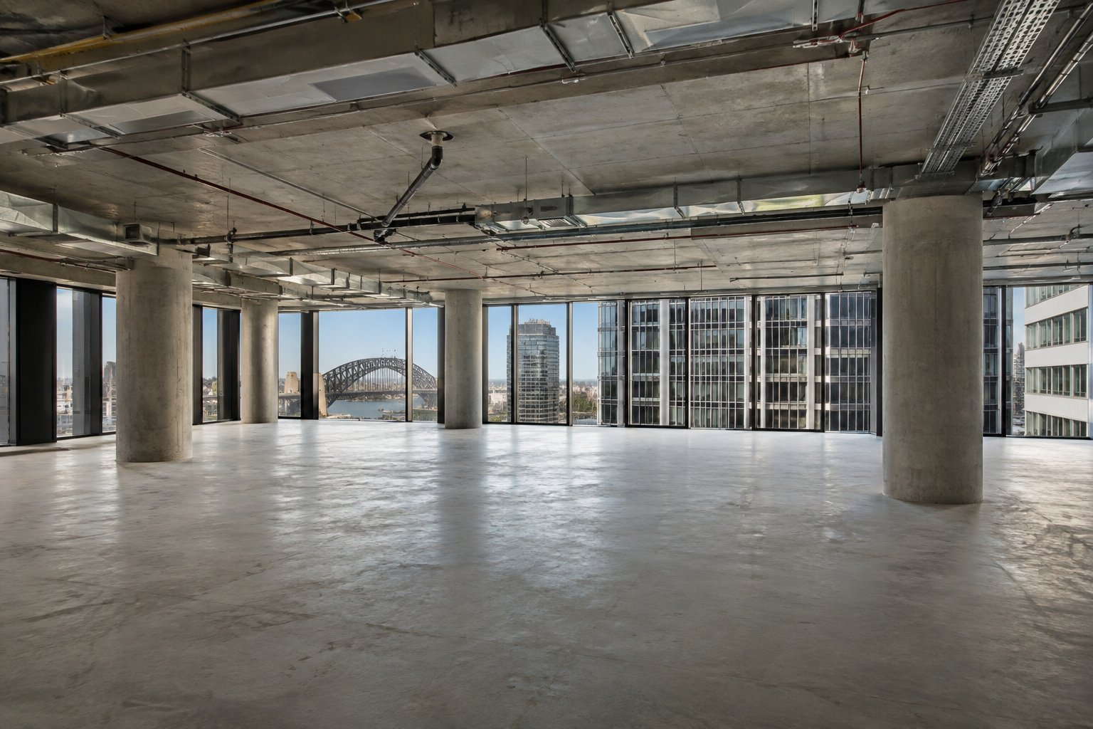 Empty Sydney office floor with columns and services before fitout test fit